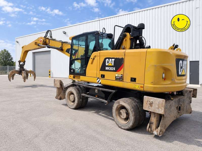 CATERPILLAR MH3024 + GRAPPLE